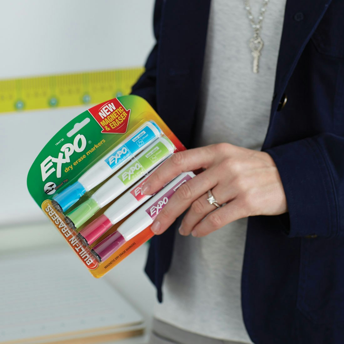 teacher-holding-pack-of-expo-markers.jpg