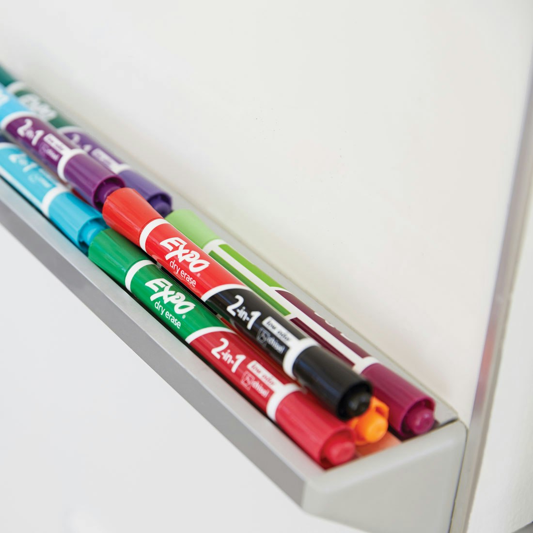 stack-of-expo-2in1-markers-below-whiteboard.jpg